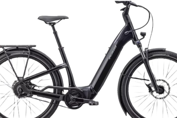 Black e-bike with step-through frame, fenders, and rear rack on a white background.