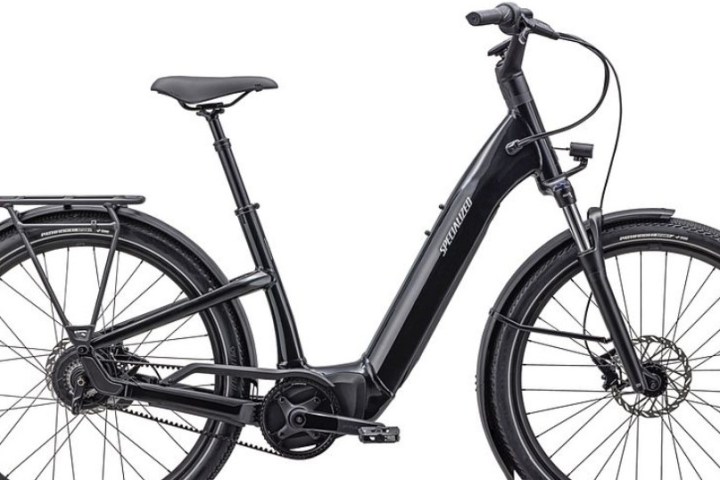 Black electric bicycle with step-through frame and rear rack, side view on white background.