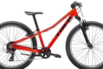 Red mountain bike with black tires and handlebars on a white background.