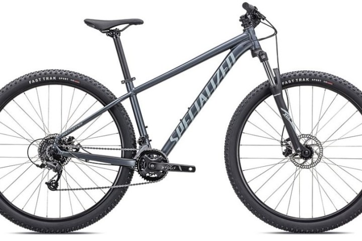 Mountain bike with blue-gray frame and black tires, viewed from the side on a white background.