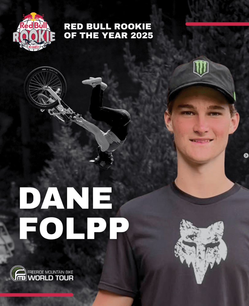 Person smiling with cap, mountain biker doing trick in background. Text: 'Red Bull Rookie of the Year 2025, Dane Folpp'