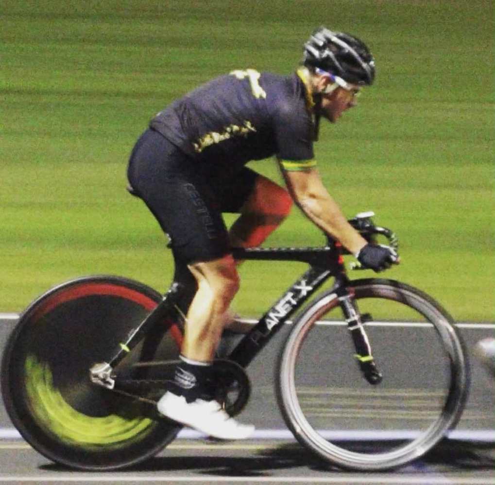 Cyclist in motion on a track with blurry background